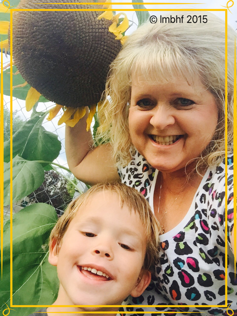 Gramma and G2's Selfie with the Sunflower!